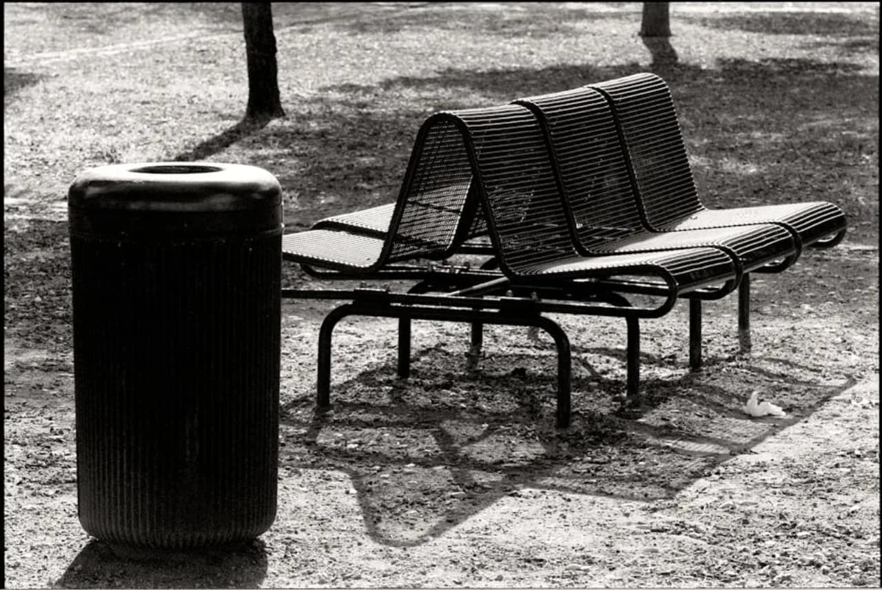 Outdoor weatherproof commercial trash receptacle for plazas, transit stops, and exterior entrances